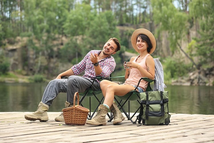 young couple on the river dock