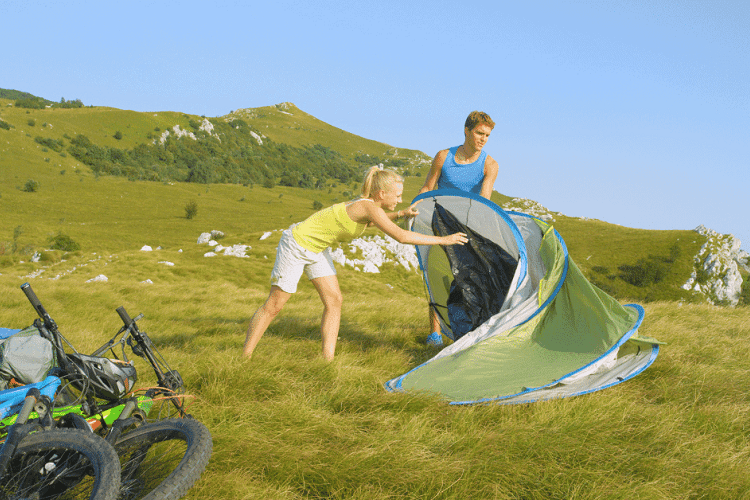 setting up a pop up tent